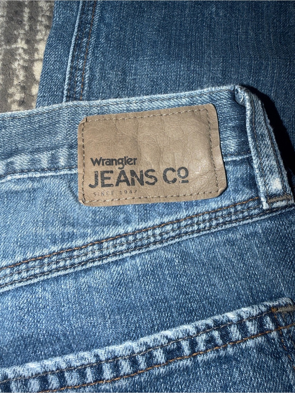 Wrangler Straight Fit Jeans in Medium Blue with Brown Patch